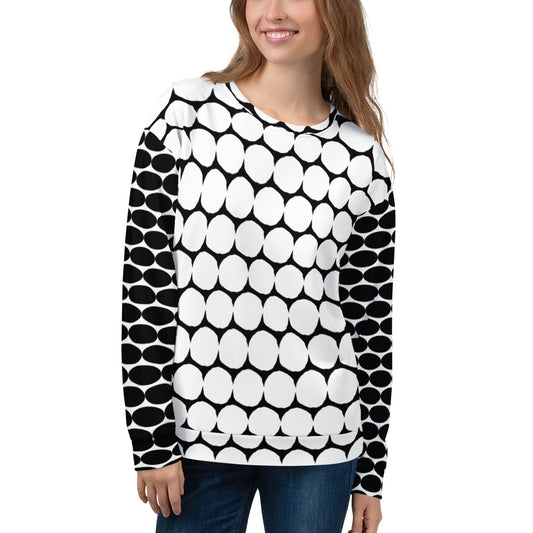 Woman wearing a black and white patterned sweater on a white background